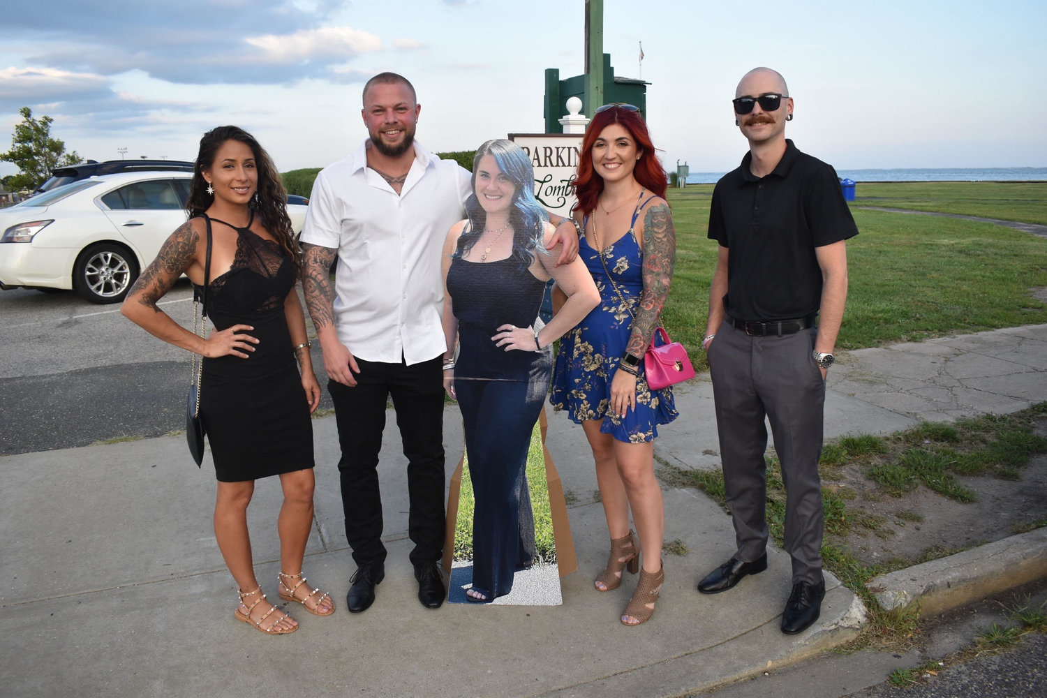 Pictured are (left to right) Brianca Donovan, Matt Gajewski, Krystina Kateridge and Jason Henriques; in the middle is a cardboard cutout picture of Desiree Errigo, a friend and fellow 2011 graduate who could not be at the reunion. Kateridge had the cutout made and asked any friends who took a photo of the cutout to tag Errigo on Instagram.
